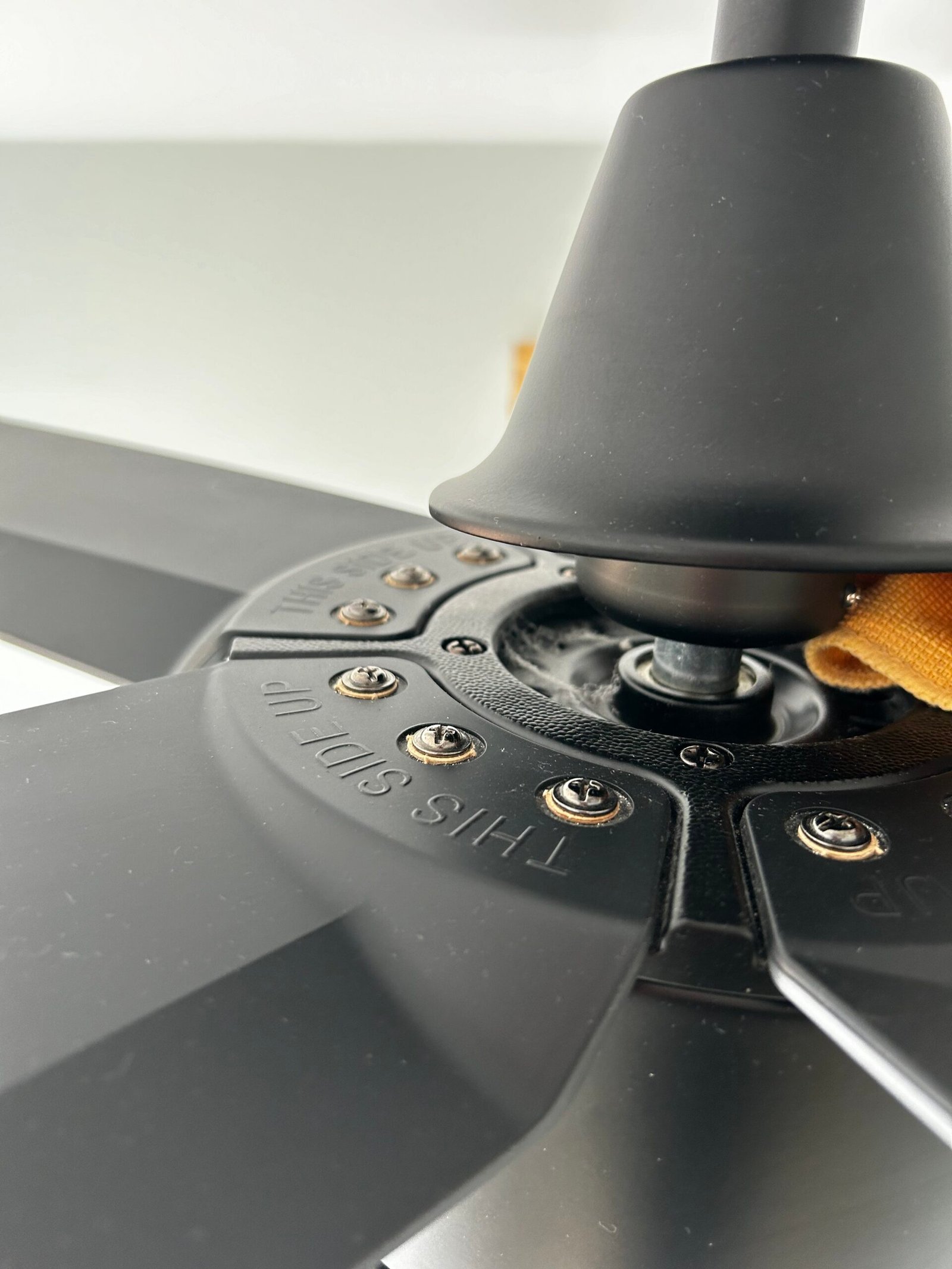 Ceiling fan covered in dust before cleaning